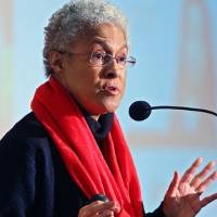 candid photo of Patricia Hill Collins presenting behind a podium